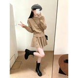 In The Autumn Of 2025, The New Women's Long-Sleeved Knitted Cardigan Is Hoisted With A High-Rise Half-Body Skirt.