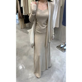 In The Autumn Of 2025, The New Women's Long-Sleeved Knitted Cardigan Is Hoisted With A High-Rise Half-Body Skirt.
